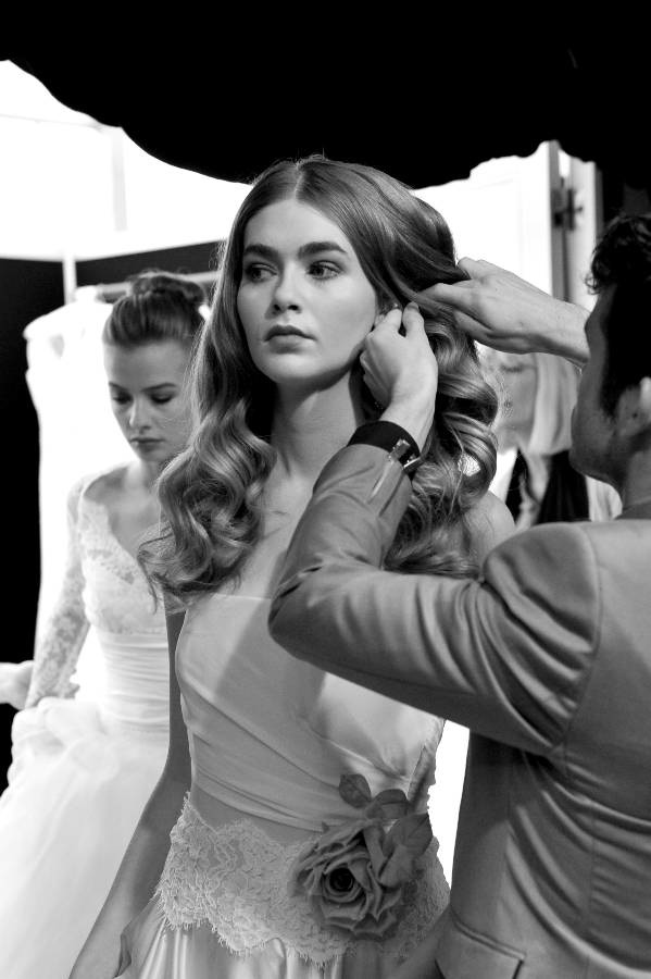 Michael Van Clarke and his team spend lots of time perfecting the models' hair backstage at The Designer Wedding Show.