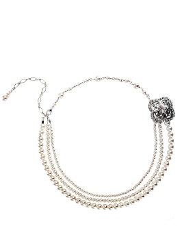 Wear a pearl necklace round your neck such as this Victoria Pearl one by Justine M Couture, £150, Queens & Bowl.